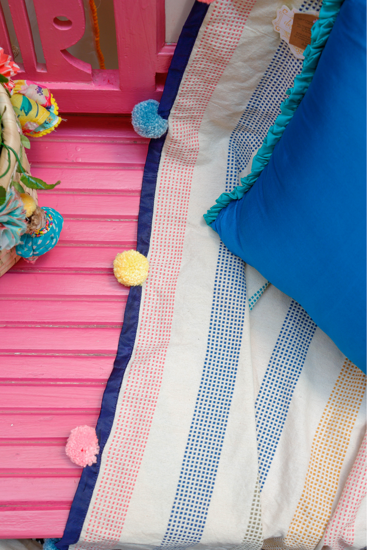 Pastel striped pompom woven throw